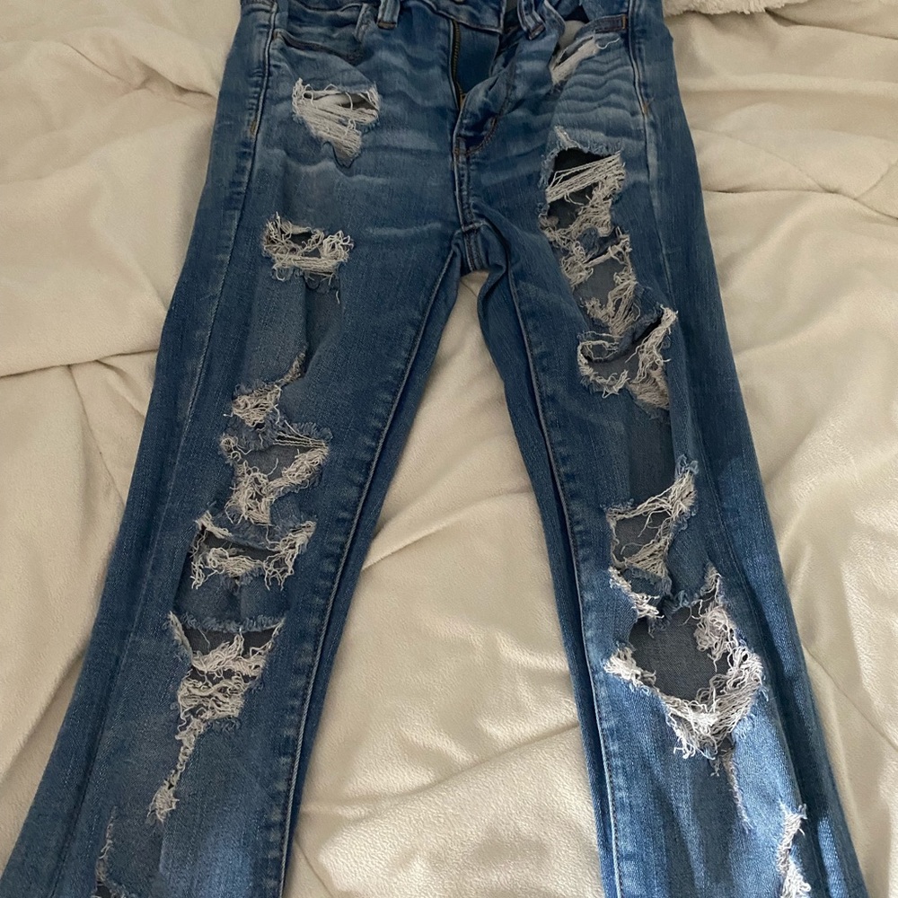 ripped jeans, never been worn